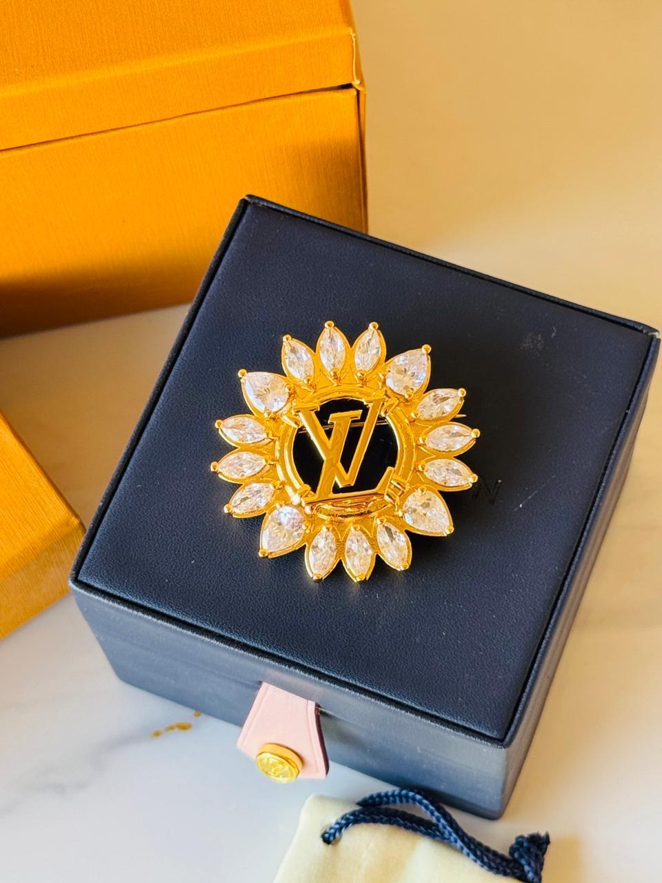 LV. Brooch