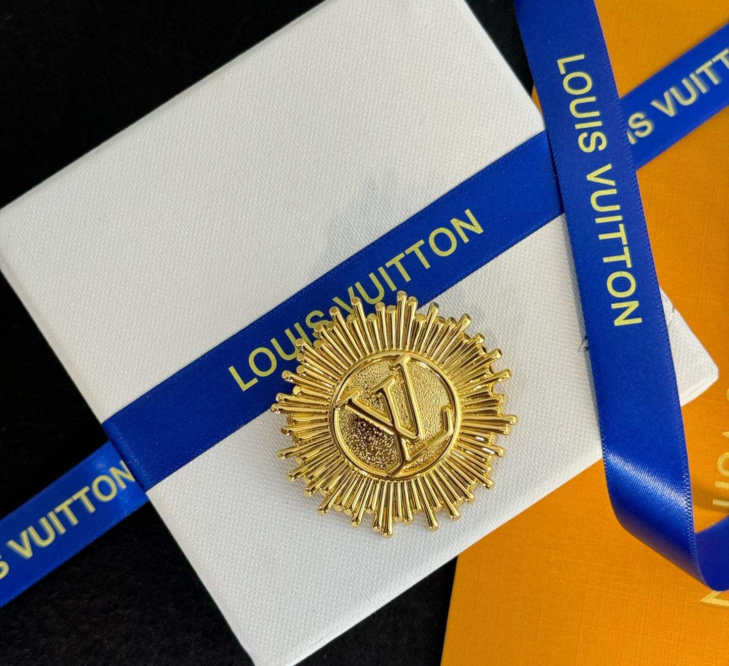 LV. Brooch