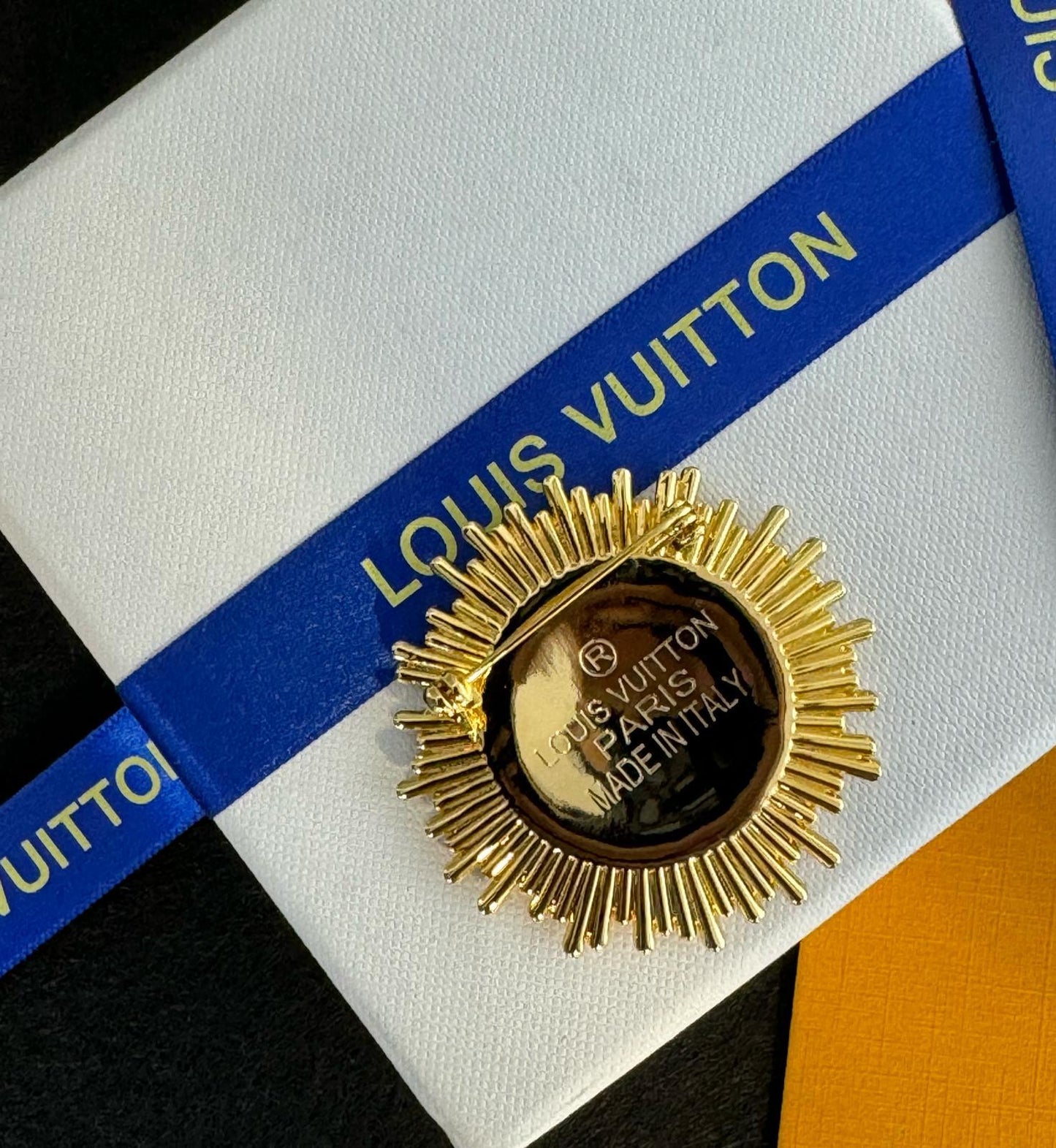 LV. Brooch
