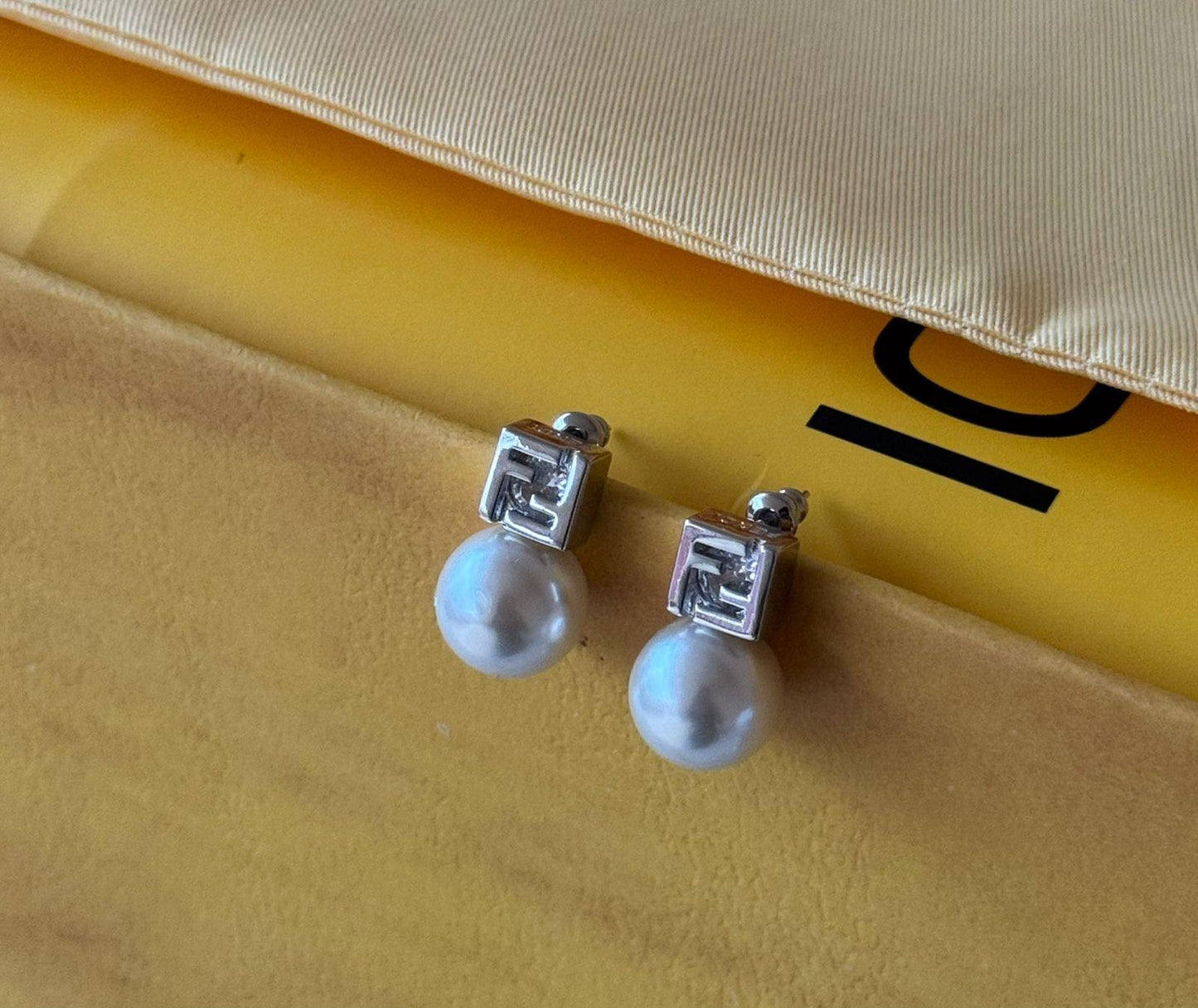 Fe. Earring