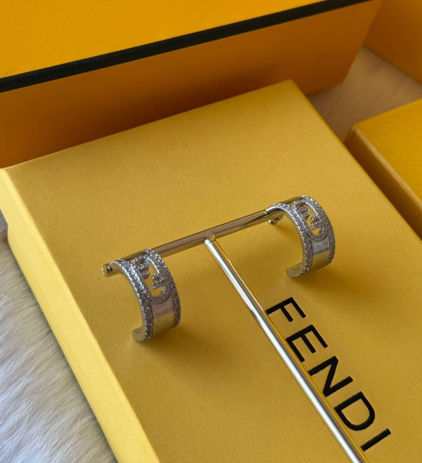 Fe. Earring
